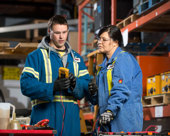 Warehouse staff looking at tools