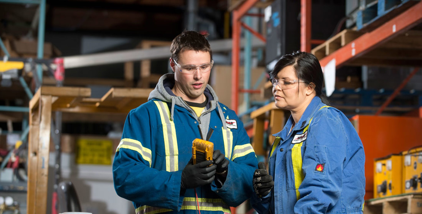 Warehouse staff looking at tools