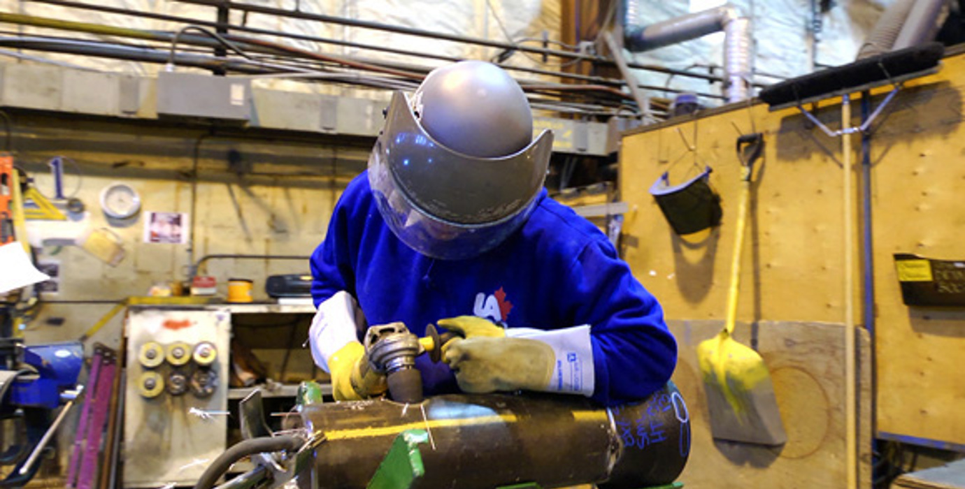 Steamfitter/pipefitter working in a shop