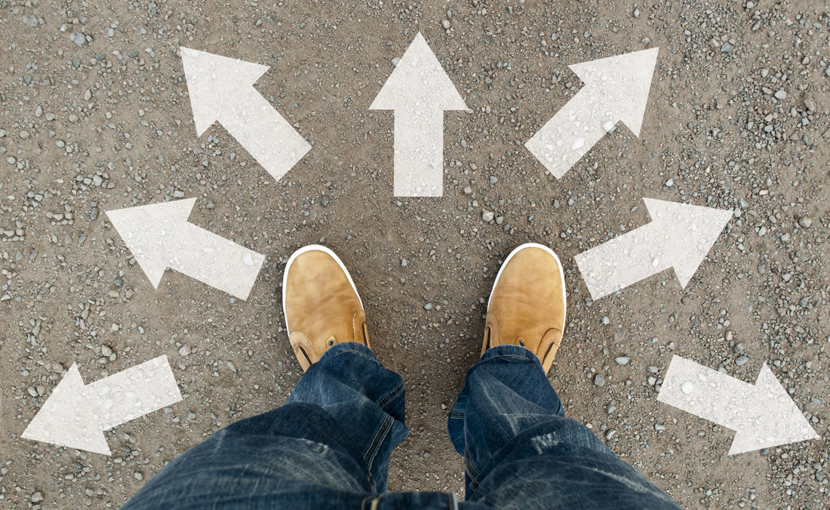 Feet amid arrows pointing in different directions