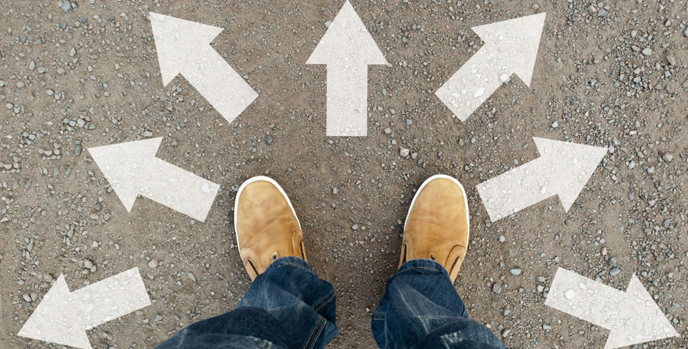 Feet amid arrows pointing in different directions