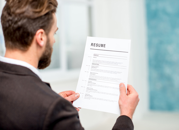 Person looking at a resumé 