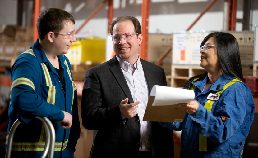 Staff having a discussion in a warehouse