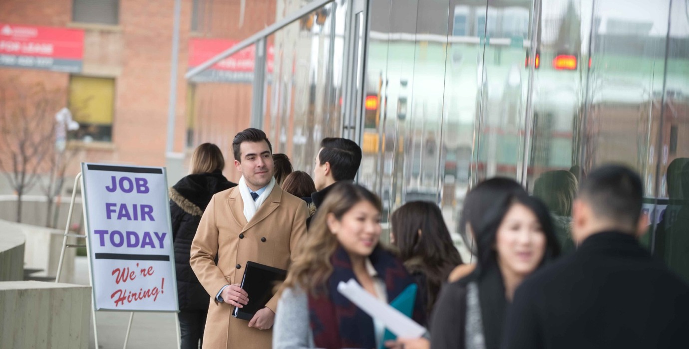 Job seekers standing in line at a job fair