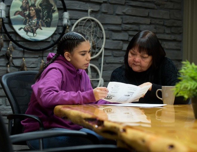 Student and Elder discussing career options looking at paperwork