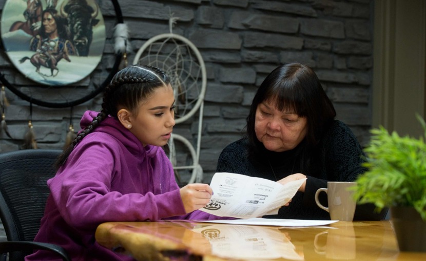 Student and Elder discussing career options looking at paperwork