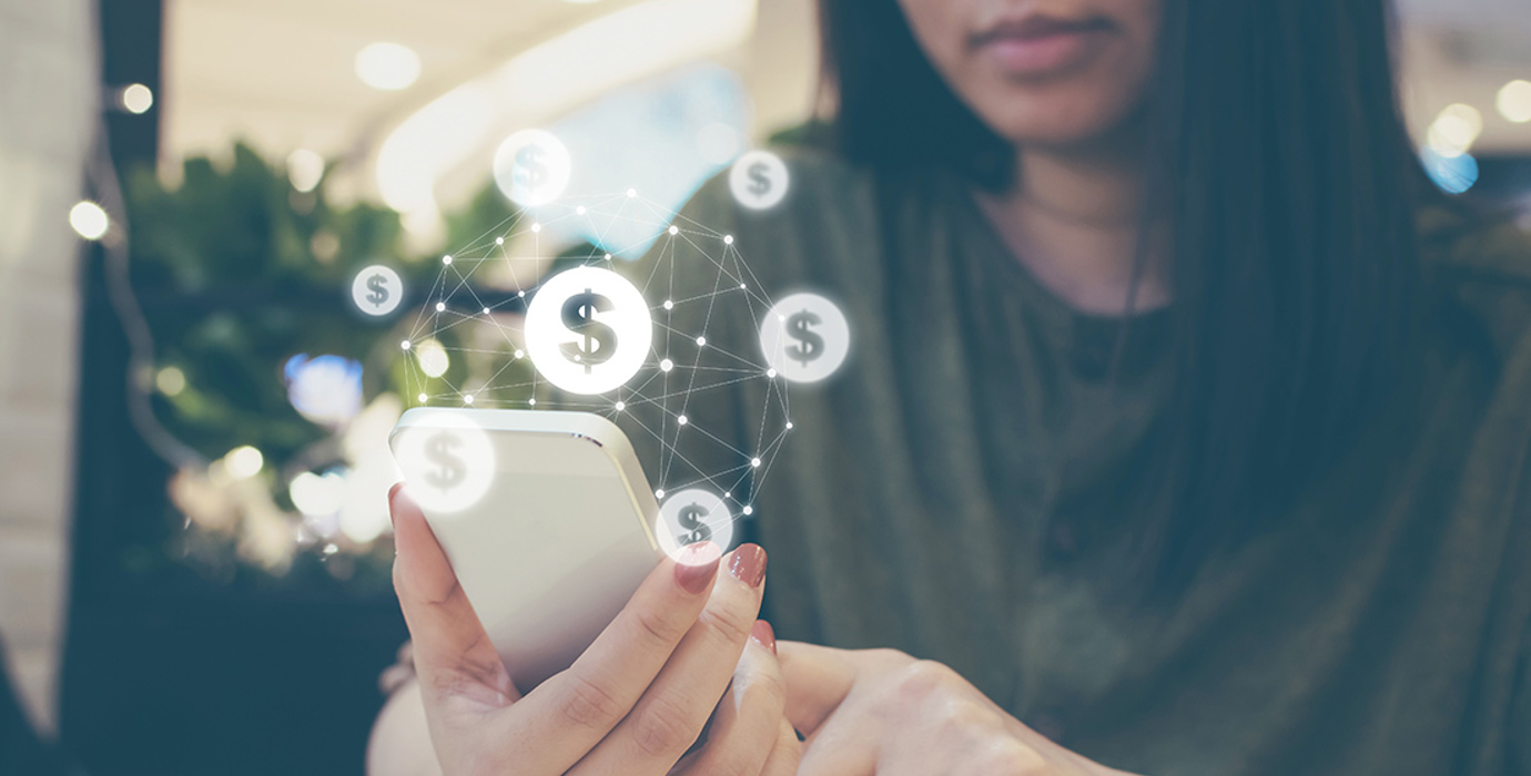 Person holding a smartphone with dollar sign graphics overlaid