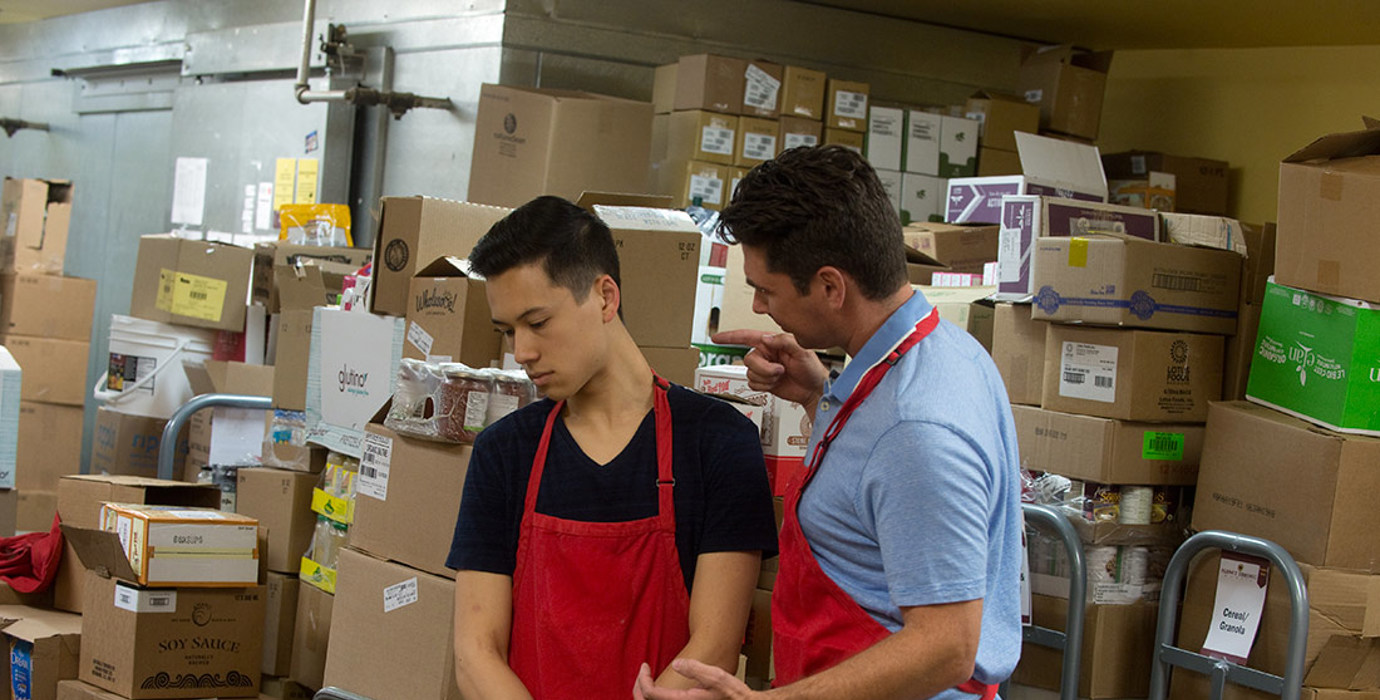 Employer bullying an employee in the storeroom