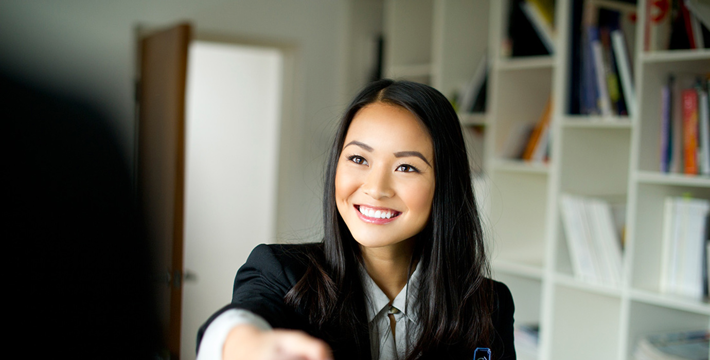 Person in business attire shaking hands