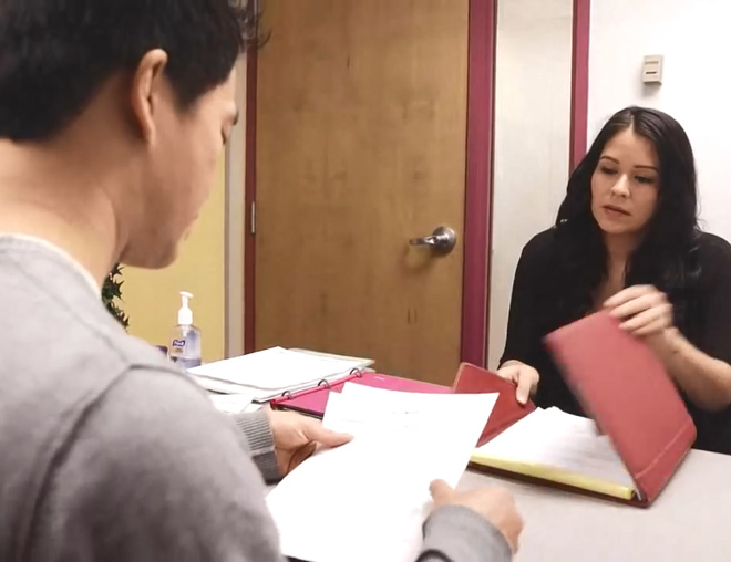 Job seeker interviewing with employer in an office