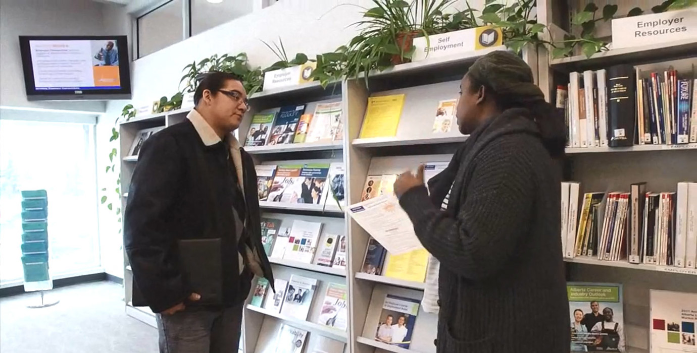 Job seeker discussing with career counsellor at an Alberta Supports Centre