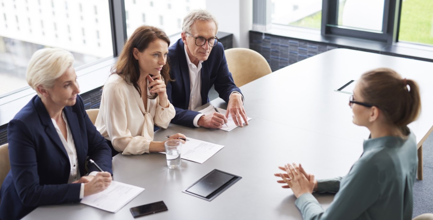 Interviewee during a job interview with a panel of 3 interviewers