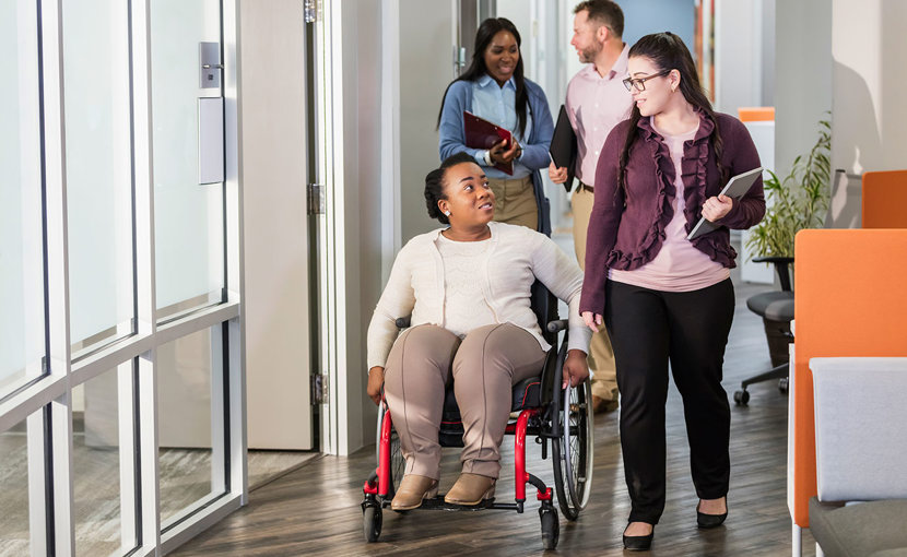 People going through a hallway to a meeting