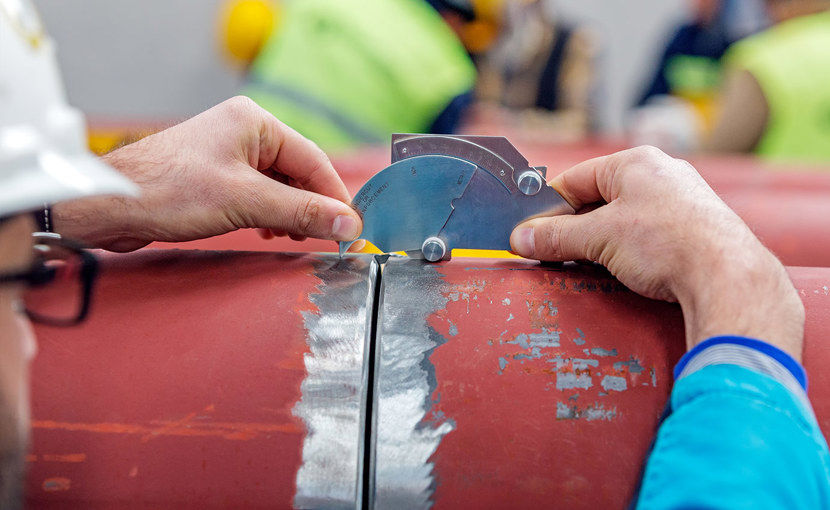 Pipeline inspector using a hi-lo inspection gauge to ensure proper pipe alignment