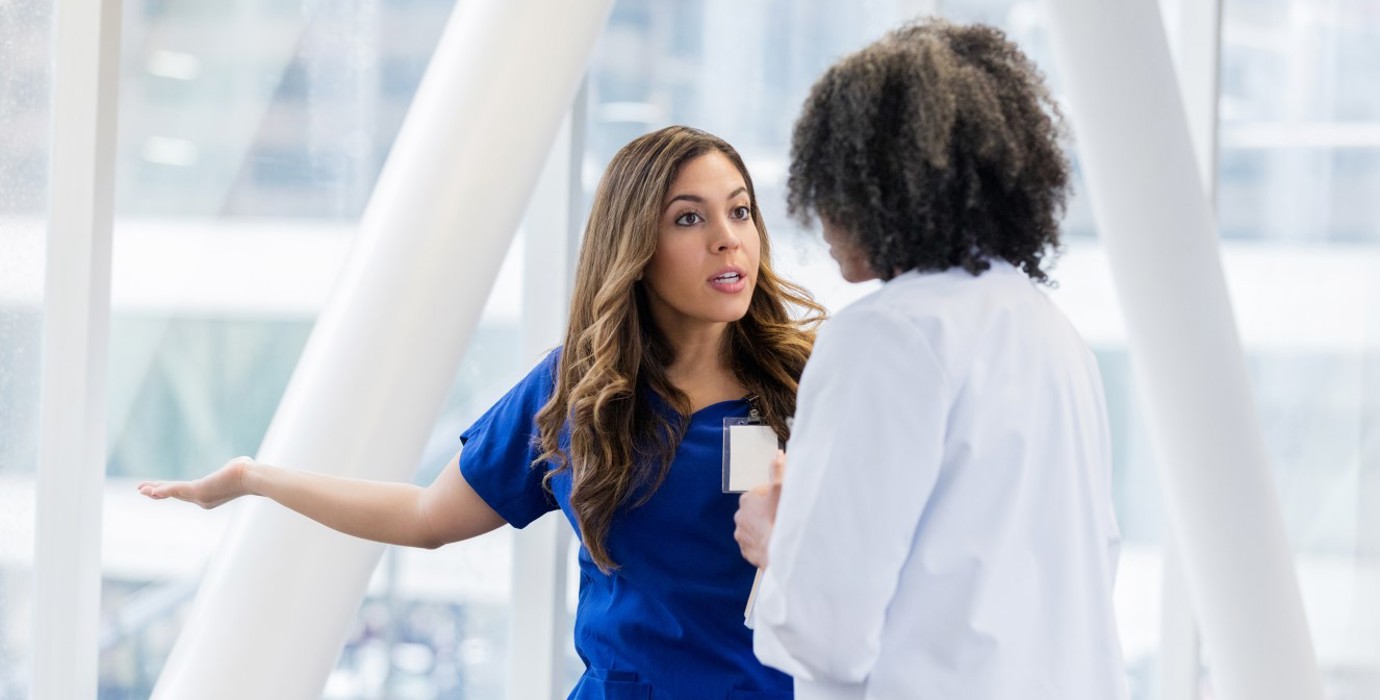 Two female health care workers having a disagreement.