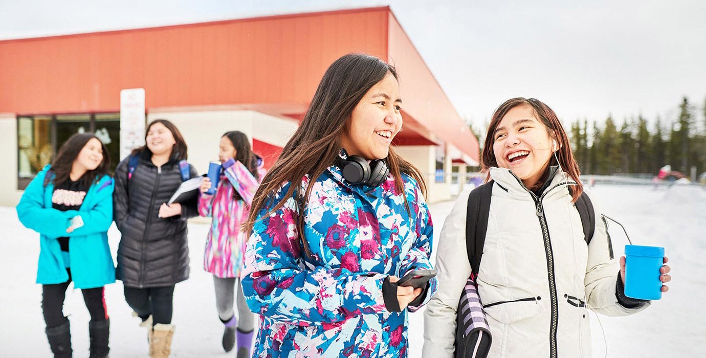 Young students leaving school during the winter.