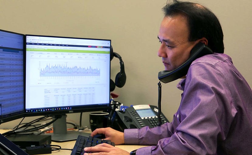 Cloud architect on the phone while working