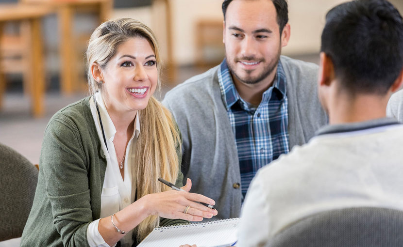 3 people in a business meeting