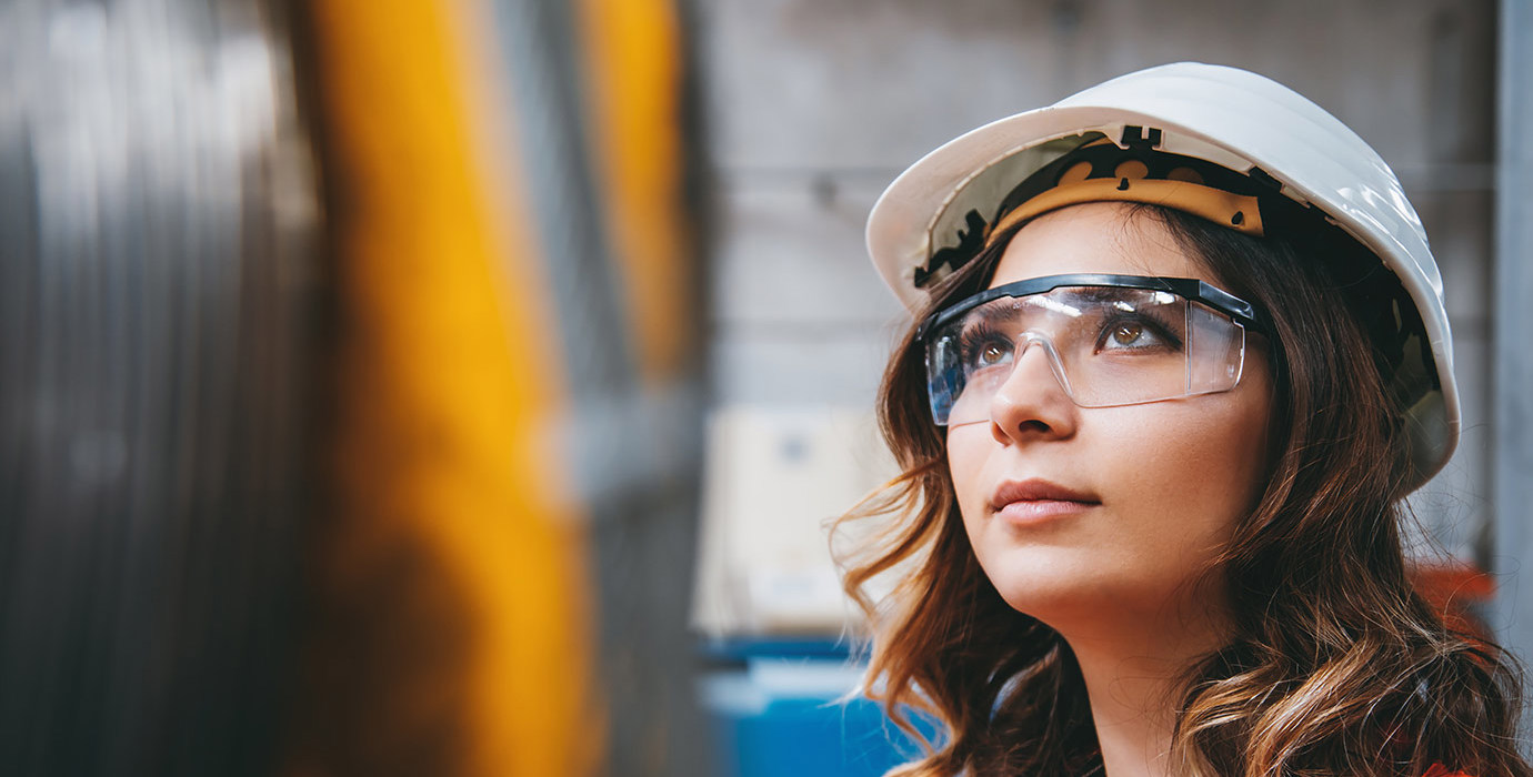 Person wearing a hard hat and PPE