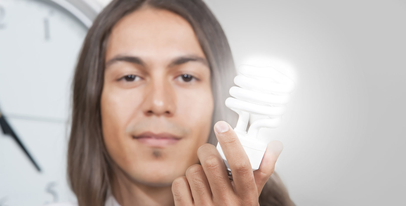 Person holding a lightbulb