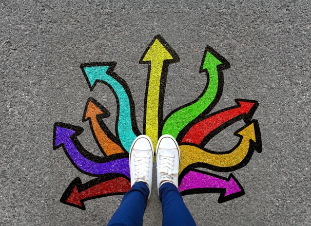 Feet on top of arrows pointing in multiple directions. 