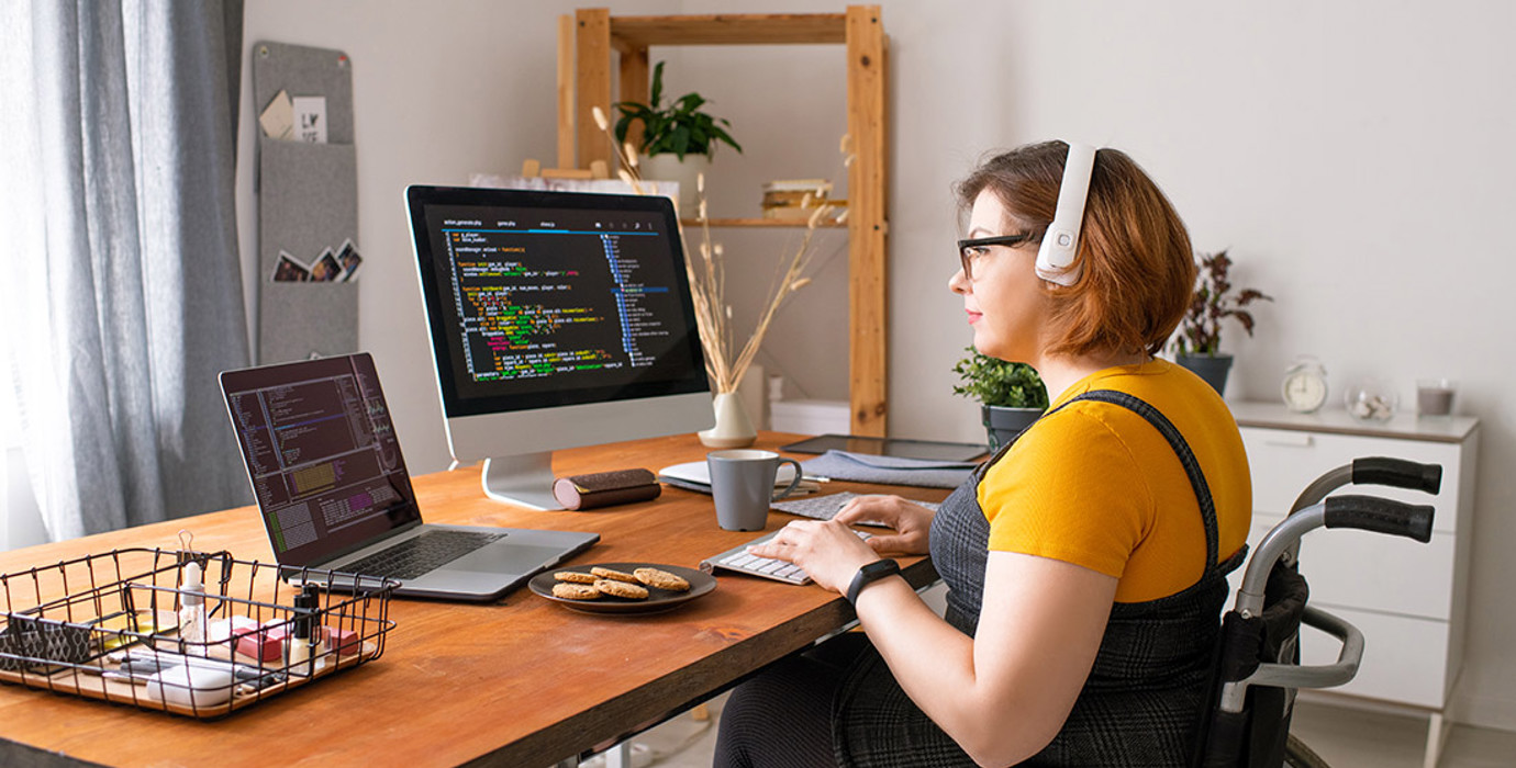 Coder in Wheelchair Working From Home