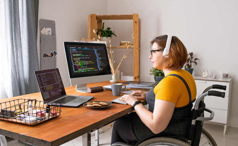 Coder in Wheelchair Working From Home