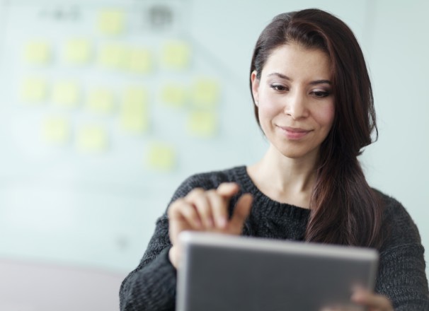 Person making a selection on a tablet. 