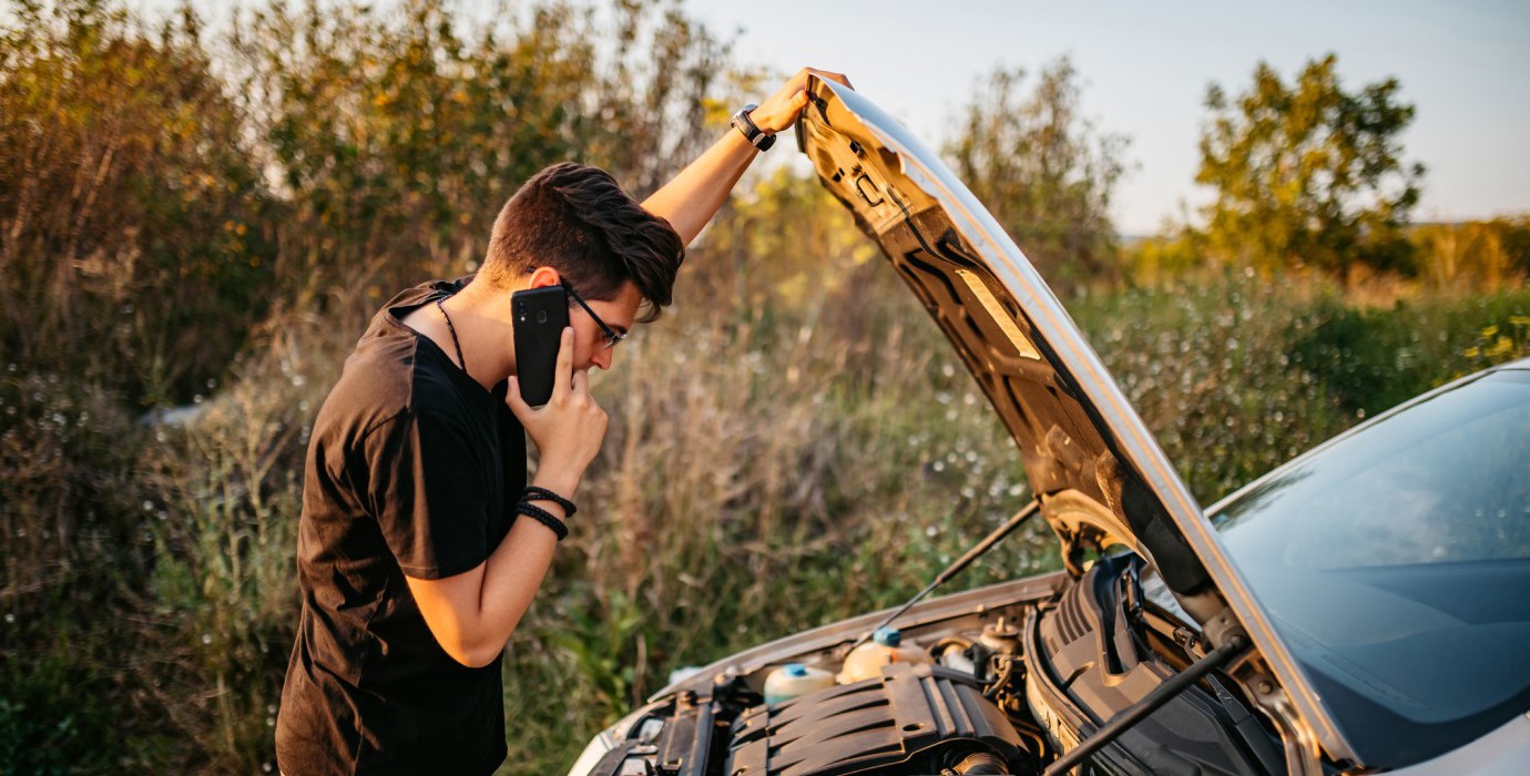 person dealing with car problem