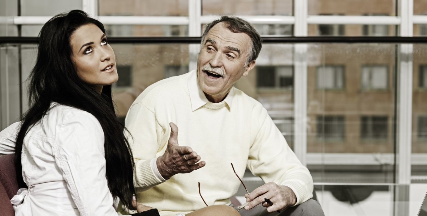 Person rolling eyes while co-worker is talking.