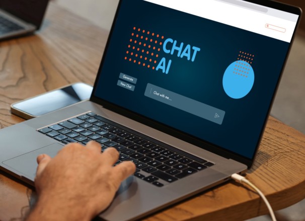 Person looking at an artificial intelligence (AI) chatbot page on a laptop. 