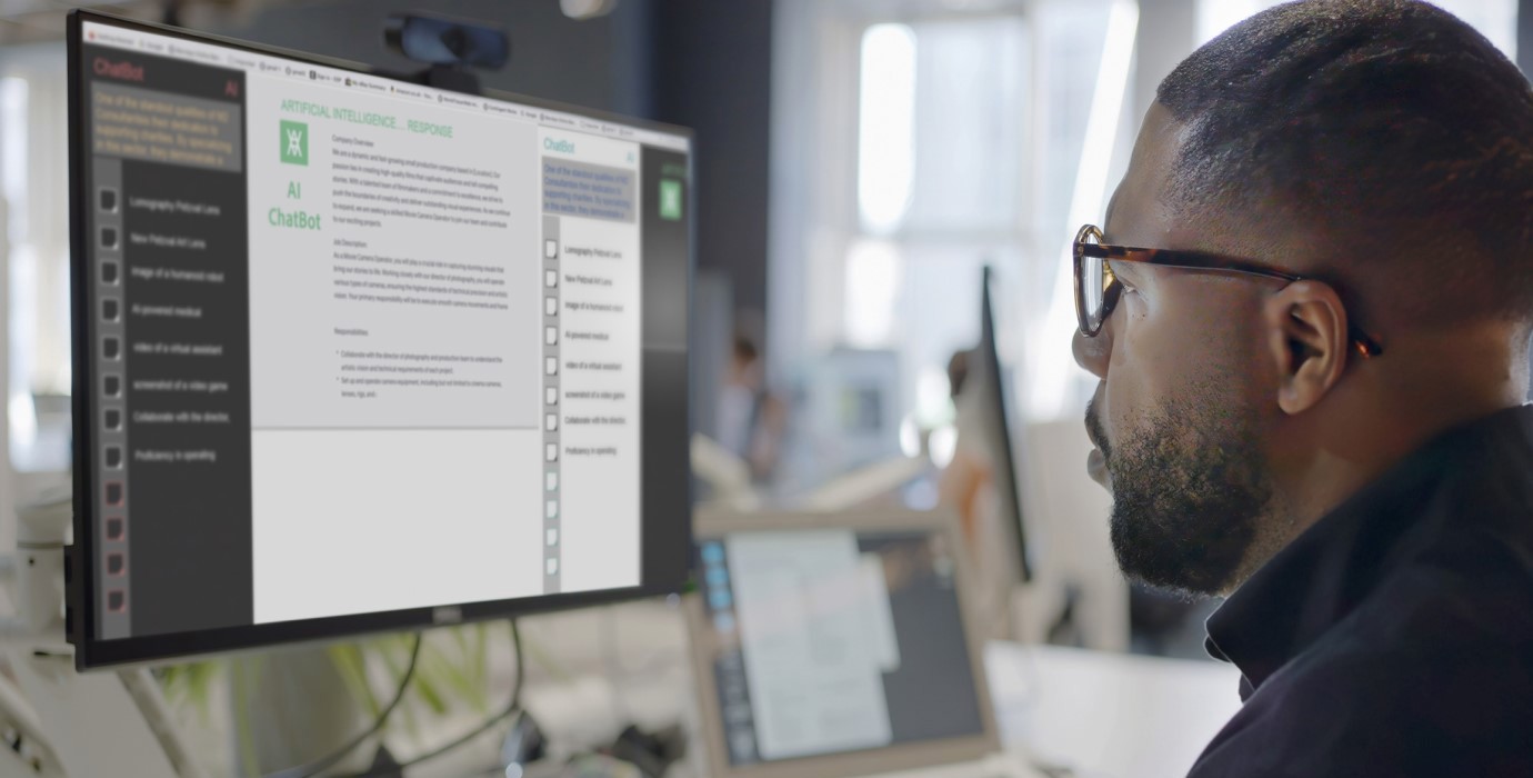 Person using desktop computer to access generative AI software.