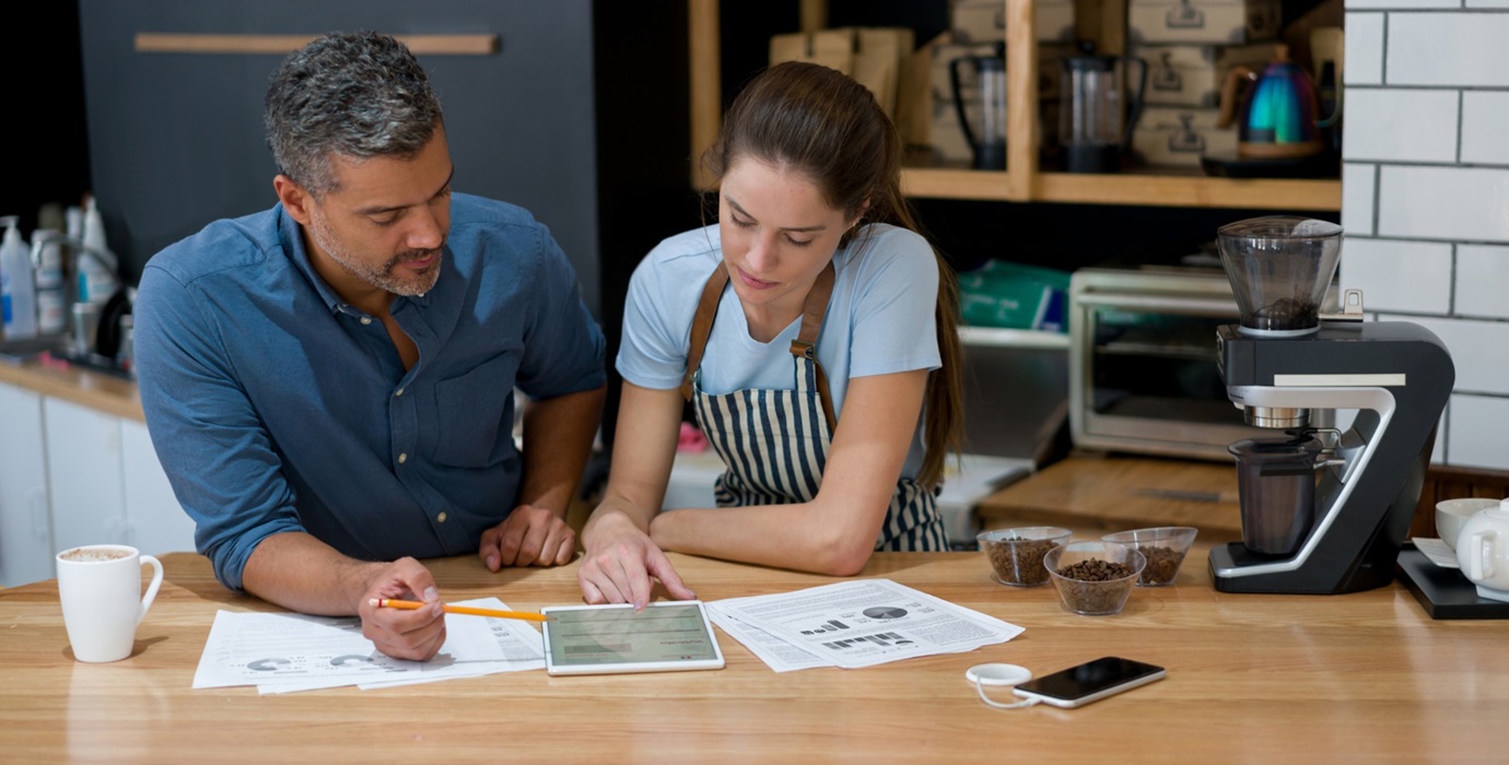 Small business owners going over finances